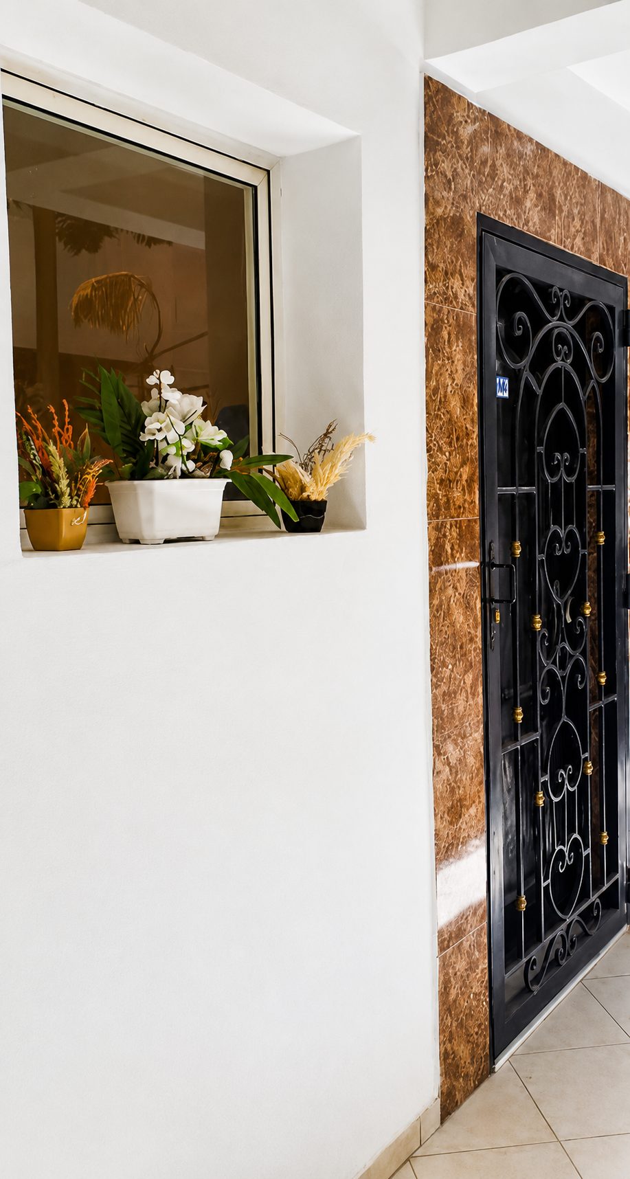 The welcoming entrance with potted plants