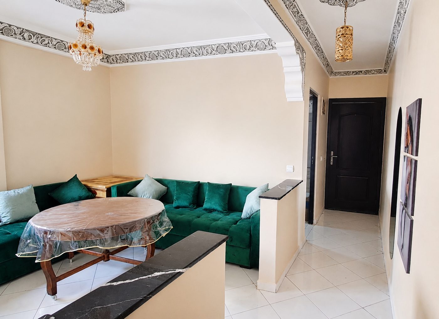 Sitting room with deep green velvet sofas